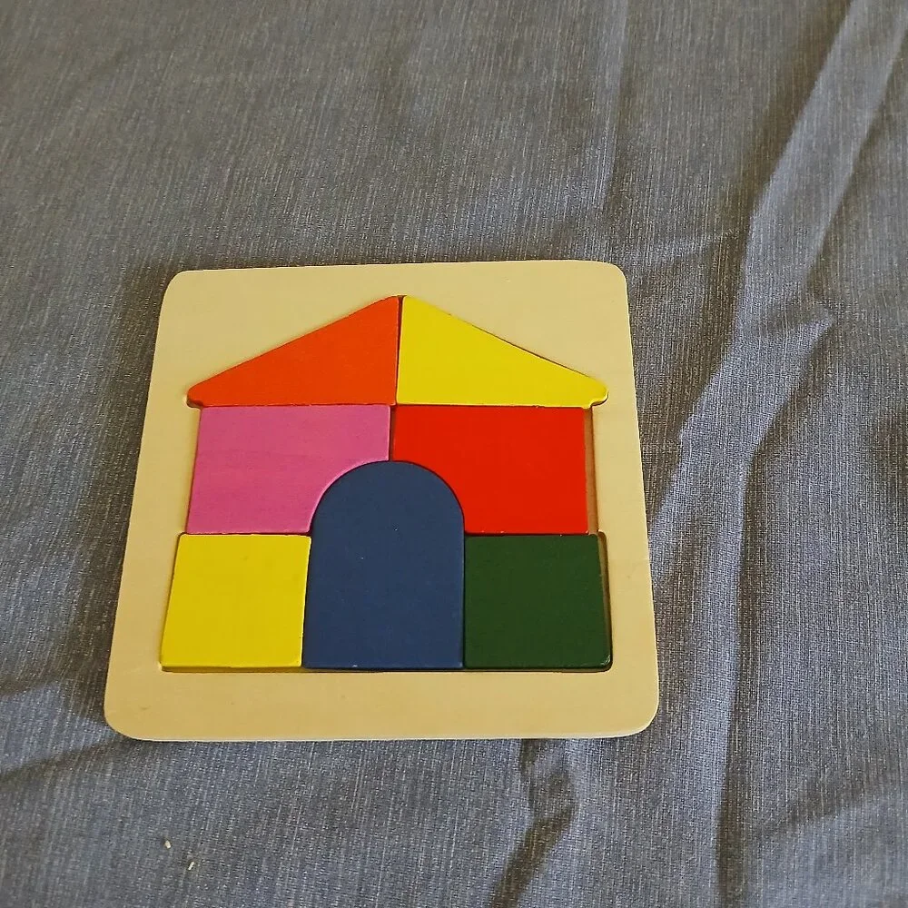 Wooden house puzzle 7 pieces used